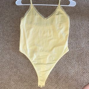yellow bodysuit